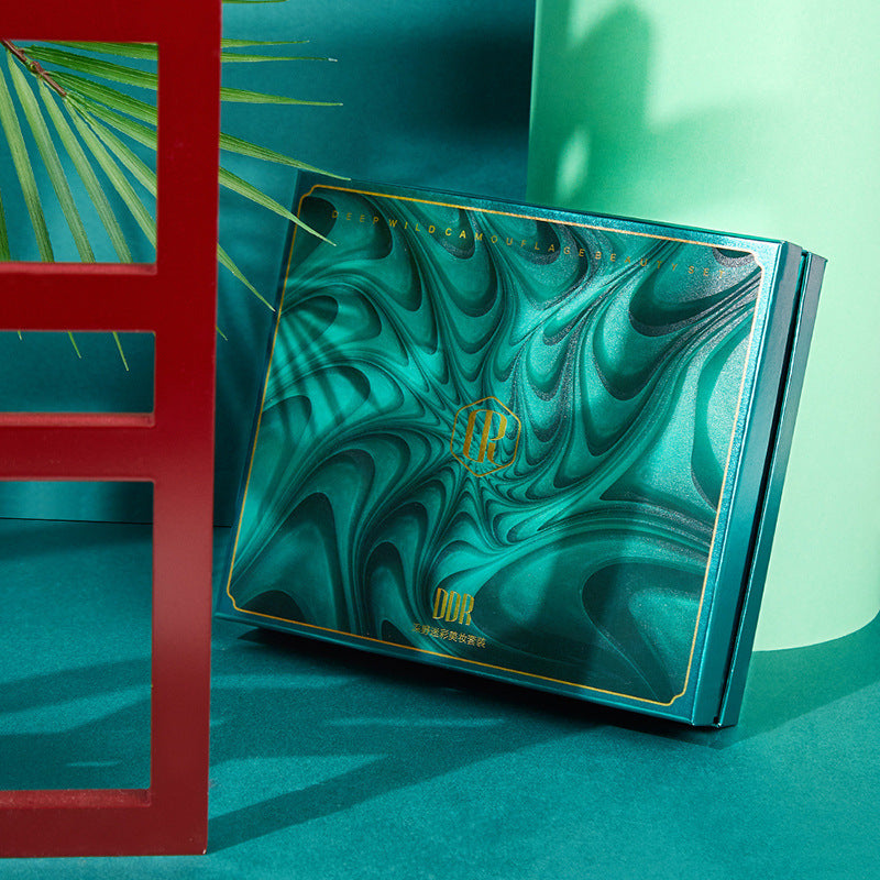 مجموعة تجميلية: كريم أساس مضغوط، أحمر شفاه، محدد عيون